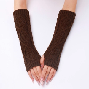 Close-up of dark brown cable knit fingerless gloves with ribbed cuffs and warm texture