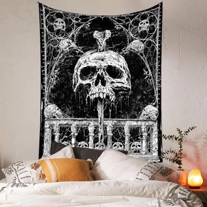 Bohemian black and white skull tapestry hanging as wall decor in a modern cozy bedroom