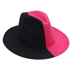 Detailed view of the felt fabric texture on a two-tone black and pink jazz fedora hat