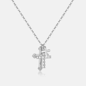 Detail of S925 silver double cross pendants with textured finish and O-chain