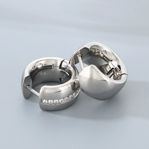 Minimalist silver huggie earrings set with polished finish and pavé cubic zirconia