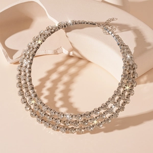 Macro detail of silver choker necklace with three rows of sparkling crystal rhinestones