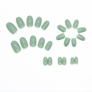 24 pieces of glossy sage green press-on nails in oval shape for a minimalist manicure