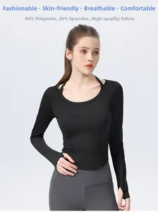 Black slim-fit long sleeve yoga top detail with 80% polyester and 20% spandex material fabric