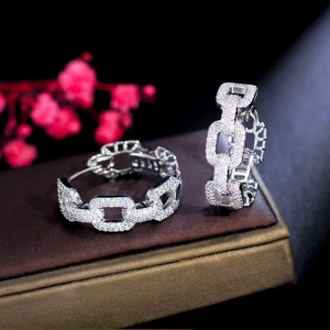 Elegant silver-toned chain drop earrings with sparkling rhinestones in a luxury setting