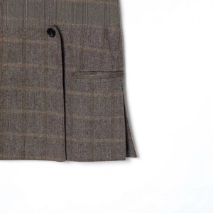 Women's herringbone plaid mini skirt in grey-brown and orange with a black button detail