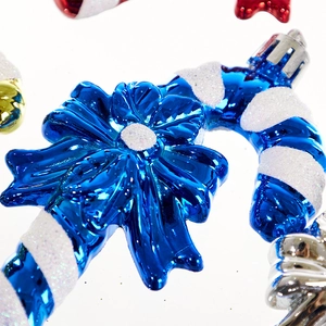 Blue and white Christmas candy cane hanging ornament with bow and glitter finish