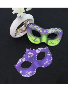 Detailed view of colorful masquerade masks with silver glitter on a matte black background