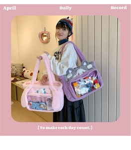 Close-up of cute plush ita bag with transparent PVC window for anime charms