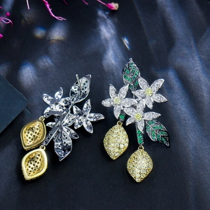 Detailed view of silver flower and lemon dangle earrings with zircon stones and S925 needles