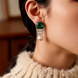 Vintage style earring set with square green gemstone and round white pearl in a luxury design