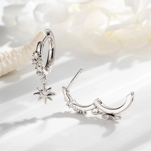 Star charm hoop earrings with cubic zirconia in silver-toned minimalist finish