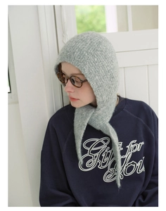 Side view of soft light grey knitted balaclava hood showing textured wool material