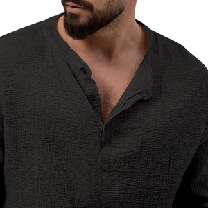 Detailed macro view of dark grey Henley shirt neckline with sharp fabric texture