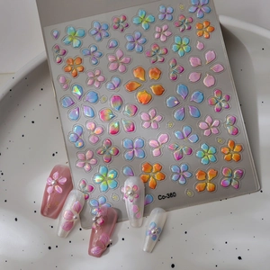 Detail of Co-360 3D embossed floral nail stickers with iridescent pearl finish and petals