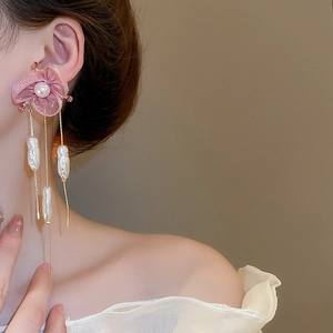 Detail of long tassel earrings with pink chiffon petals and hanging baroque pearls