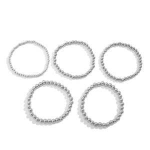 Detail view of five silver metal beaded heart bracelets set in various bead sizes and lengths
