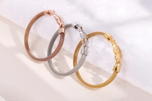 Detail of woven mesh texture on MOM bracelets in rose gold, silver, and gold finish