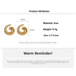 Detail view of golden spiral snail earrings with size dimensions and weight specifications