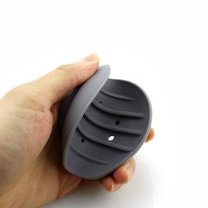 Close-up of flexible grey silicone soap holder showing durability and shell-like design