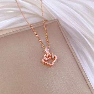 Luxurious rose gold titanium steel necklace with a sparkling heart-shaped pendant on satin