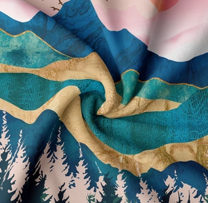 Detail of artistic forest tapestry fabric showing fabric texture and mountain print