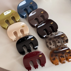 French style M-shaped hair claws in nine varied colors with gold Love details