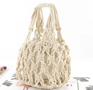 Detail of hand-woven cotton net bag with natural linen drawstring inner pouch