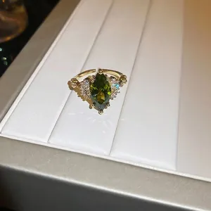 14K gold plated ring with vintage marquise-cut emerald and white zircon accents