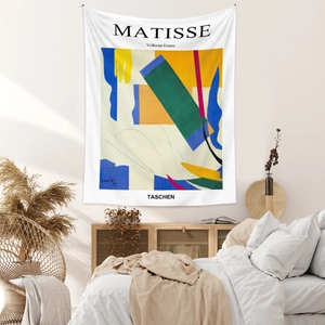Detail of Henri Matisse style abstract tapestry hanging in a cozy bedroom setting