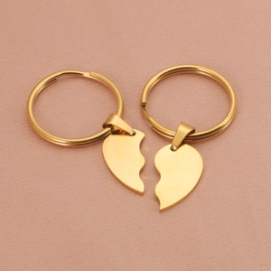 Matching stainless steel heart puzzle keychains for couples in a gold finish