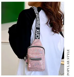 Pink matte leather chest bag with iridescent letter print and wide logo strap