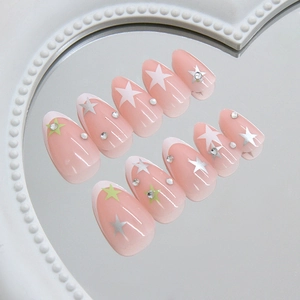 Star pattern almond press-on nails with French tips and sparkling rhinestones