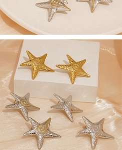 Close-up of starfish earrings featuring hammered texture and golden spiral details