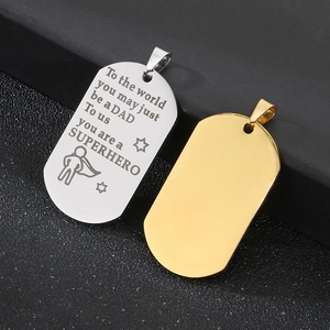 Detailed view of silver and gold stainless steel dog tags with Father's Day engraving