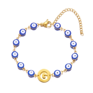 Golden Evil Eye beaded bracelet with letter G charm and adjustable lobster clasp