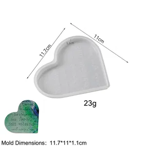 Macro detail of heart-shaped silicone mold with engraved memorial quote for resin DIY