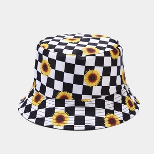 Reversible daisy checkered bucket hat with yellow sunflower pattern for men and women