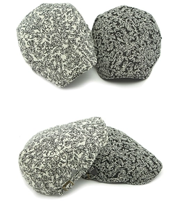 Detail of floral newsboy cap with adjustable metal buckle and vintage jacquard fabric