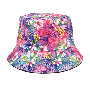 Double-sided bucket hat featuring vibrant flamingo and tropical flower prints in pink and blue