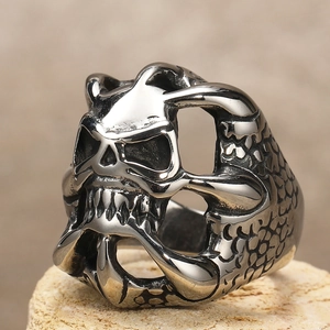 Detailed macro view of the vintage silver skull ring with an oxidized gothic finish