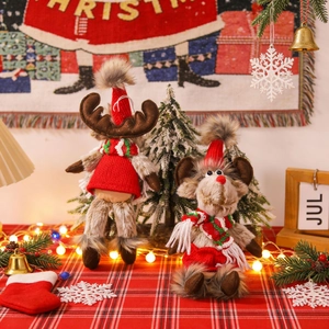 Adorable plush reindeer Christmas figurines in festive red knit outfits for holiday decor