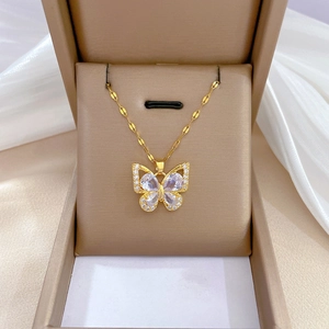 Elegant gold butterfly necklace with zircon stones in a luxury gift box with silk fabric