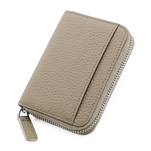 Detail of taupe leather card holder with lychee texture and silver zipper pull
