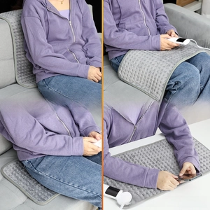 Gray heating pad with controller showing versatile use for back relief and leg warmth