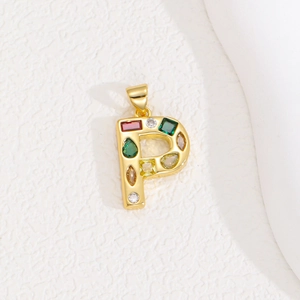 Detail of gold letter P pendant with colorful zircon stones and polished finish