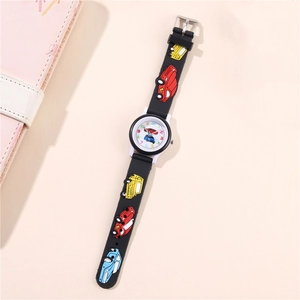 Detailed view of children's quartz watch with black silicone strap and 3D car patterns