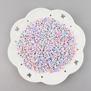Colorful A-Z alphabet beads set on white acrylic flat round discs for DIY jewelry