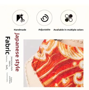 Detail of handcrafted cotton linen pet bandana featuring traditional Japanese wave patterns