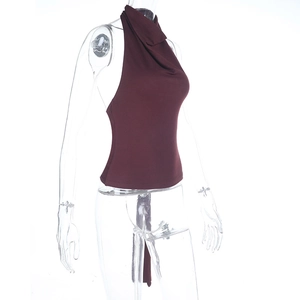 Detail of burgundy backless halter top showing the fitted cut and marsala red fabric texture
